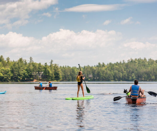 Kayaking and paddling on serene Lake Iona at Huttopia White Mountains